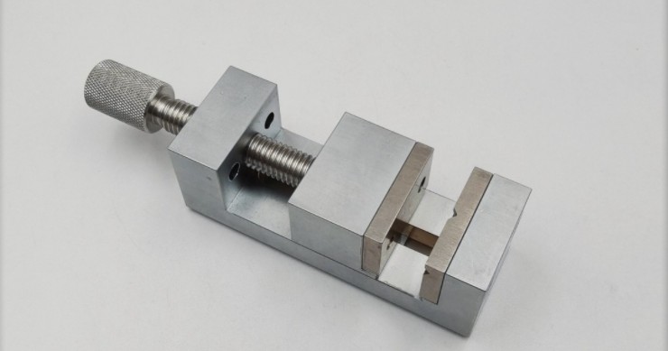 Small stainless steel vise tool for jeweler's watch and watch