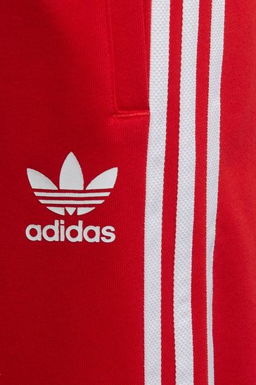 بنطلون رياضي بثلاثة خطوط حمراء من adidas Originals